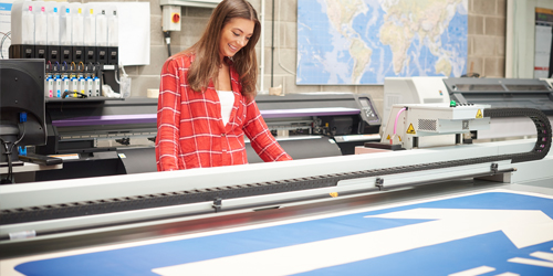 woman at printing press