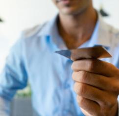 man holding business card